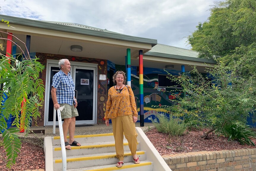 Middle-aged man and woman, socially distanced, stand on the entrance steps of Albury's Westside Community Centre.