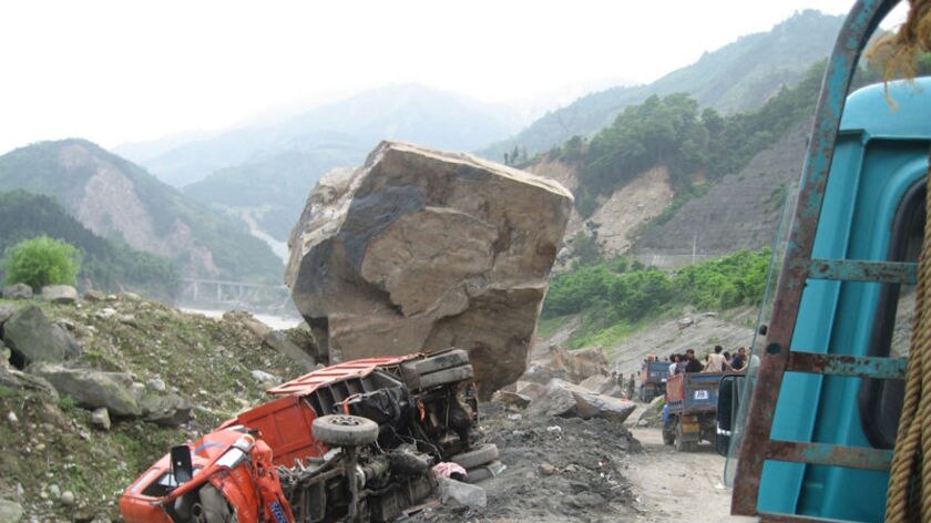 An overturned truck in the earthquake-devastated town of Ying Xiu.