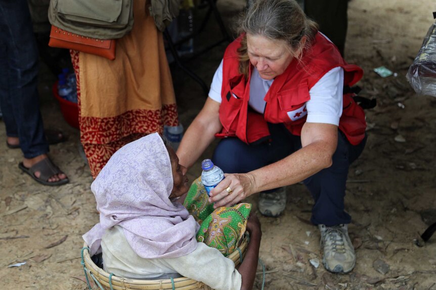Red Cross nurse Libby Bowell providing health care in the Bangladesh camps.