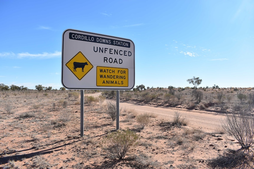 A sign welcoming travellers to Cordillo Downs Station, with a warning to watch for wandering animals.