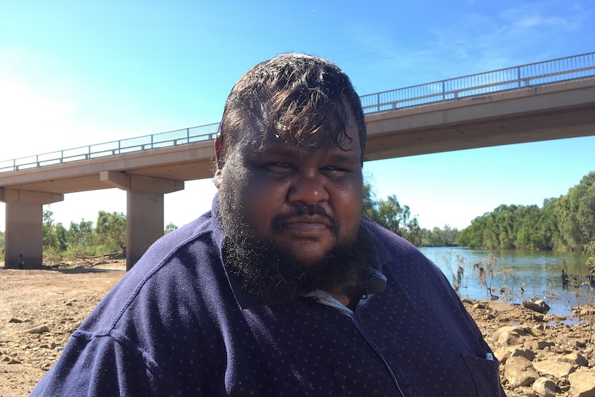 Gadrian Hoosan sits by the river