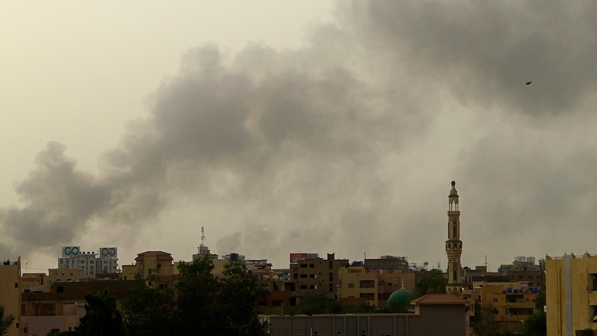 Smoke billows over buildings in southern Khartoum.