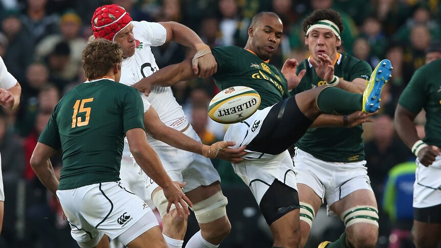 The Springboks and England scrap for the ball