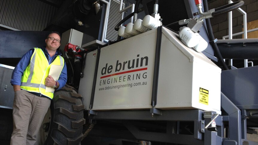 Business development manager, David Tye, shows off the newest Harrington Seed Destructor.