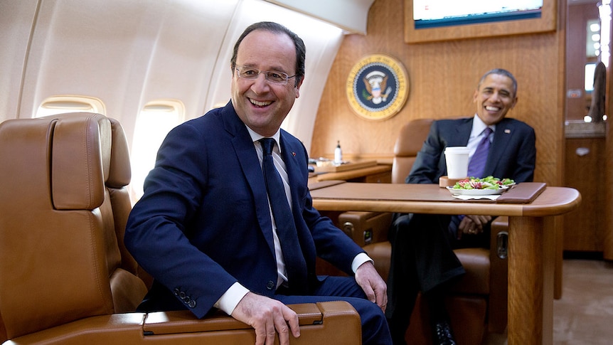 Francois Hollande aboard the Air Force One Jet with Barack Obama.
