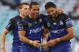 Will Hopoate and Curtis Rona celebrate a try against the Dragons