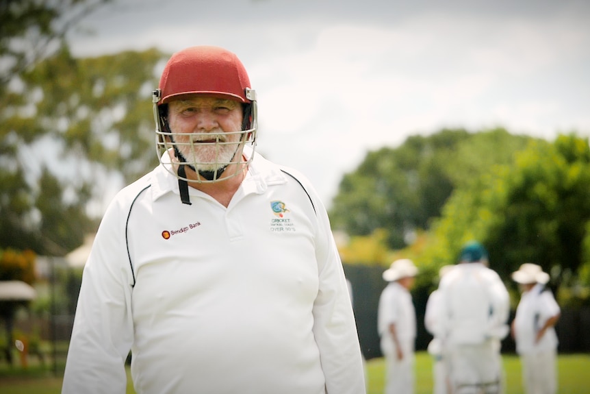 The veteran cricket player smiles