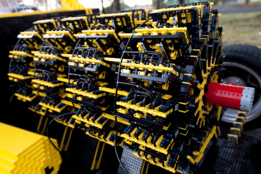 The engine of a car built out of 500,000 pieces of Lego.