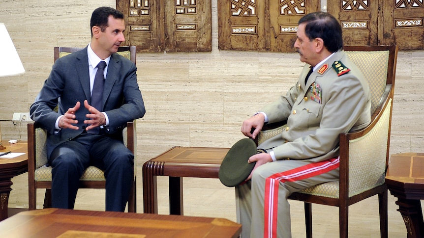 Syrian General Fahd al-Freij (R) meeting with Syrian president Bashar al-Assad in Damascus following his swearing in.
