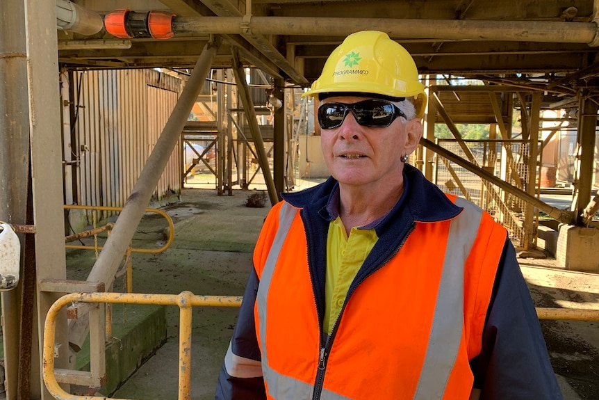 Grant Schuhmann in high-vis vest and helmet.