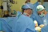 Doctors perform surgery