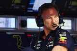 Red Bull Racing Team Principal Christian Horner looks on from the pit wall