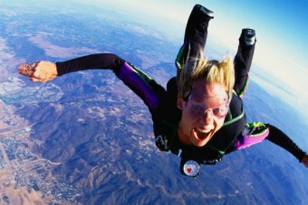 A woman skydiving.