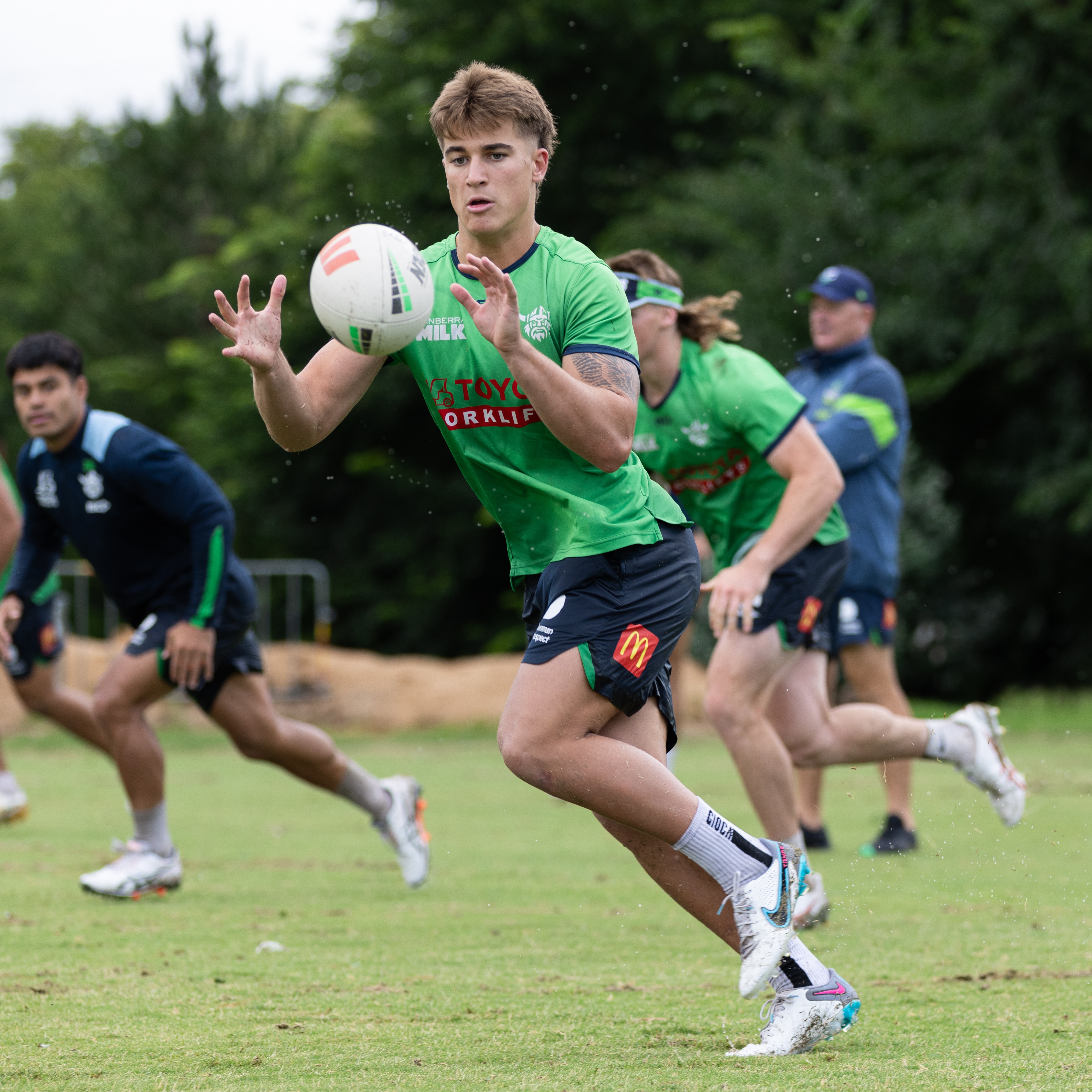 A player catches the ball during a rugby league training session