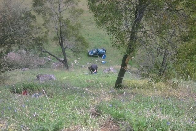 Car at the bottom of a hill, after rolling 50m