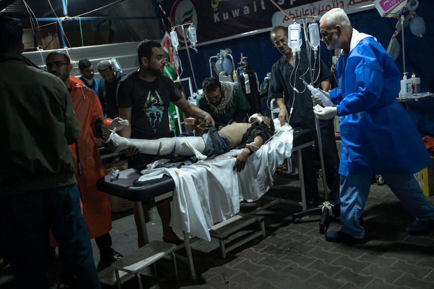 A Palestinian wounded in the Israeli bombardment of the Gaza Strip arrives at a hospital in Rafah