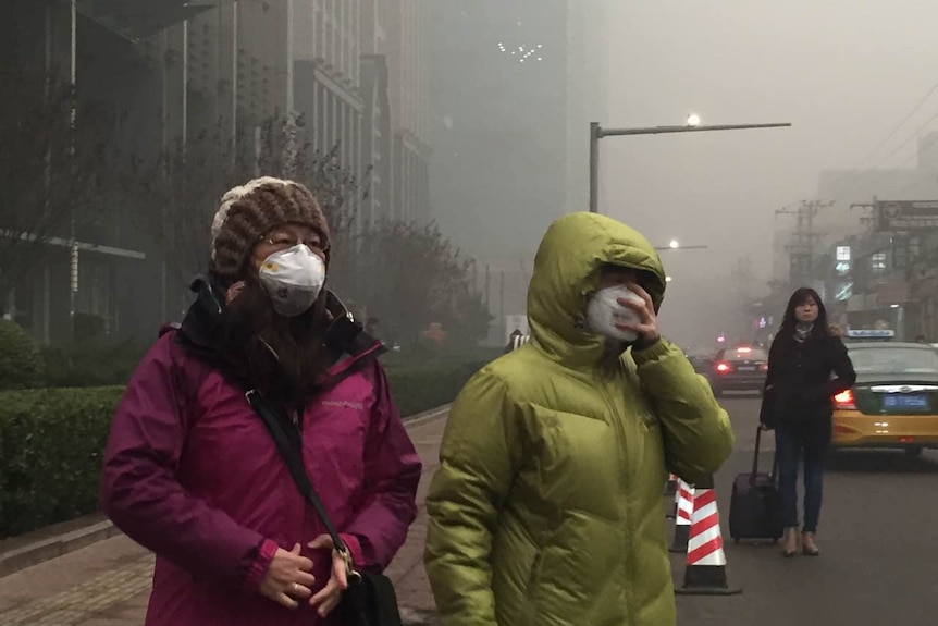 Smog over Beijing, China, people wear masks, as air pollution takes over December 19, 2015