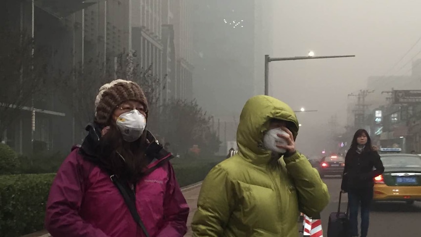 Smog over Beijing, China, people wear masks, as air pollution takes over