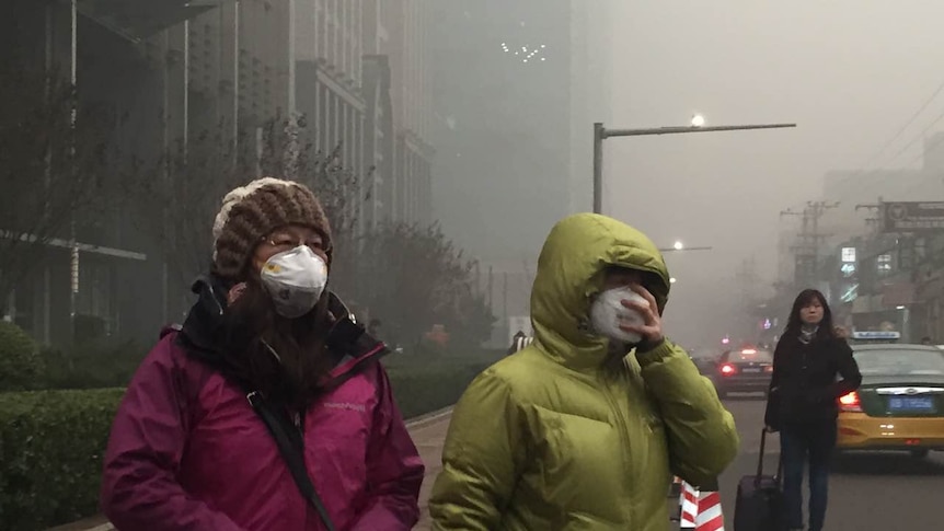 Smog over Beijing, China, people wear masks, as air pollution takes over December 19, 2015