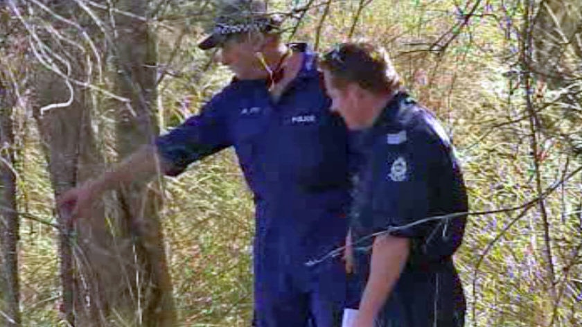 Police search bush near the Serpentine River where Timothy Everington was murdered last May.
