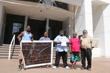 Borroloola petitioners standing on the steps of NT Parliament.