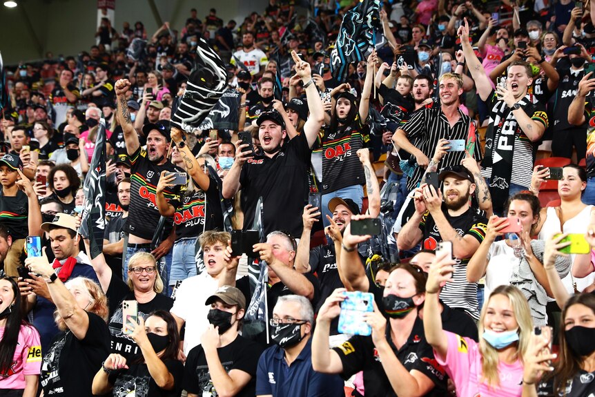 Panthers fans celebrate their team's victory in the NRL Grand Final.