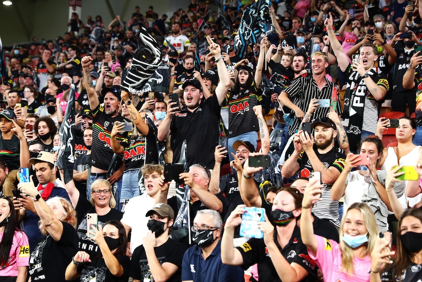 Panthers fans celebrate their team's victory in the NRL Grand Final.