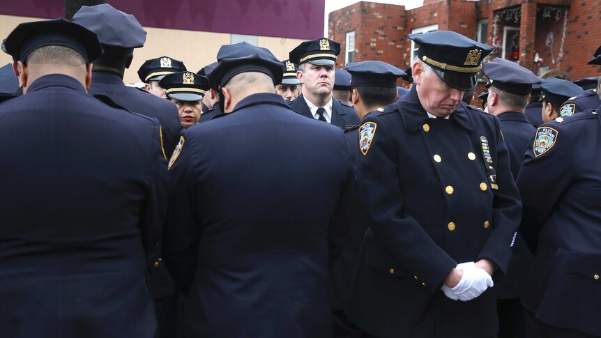 Police officers protest at Wenjian Liu's funeral