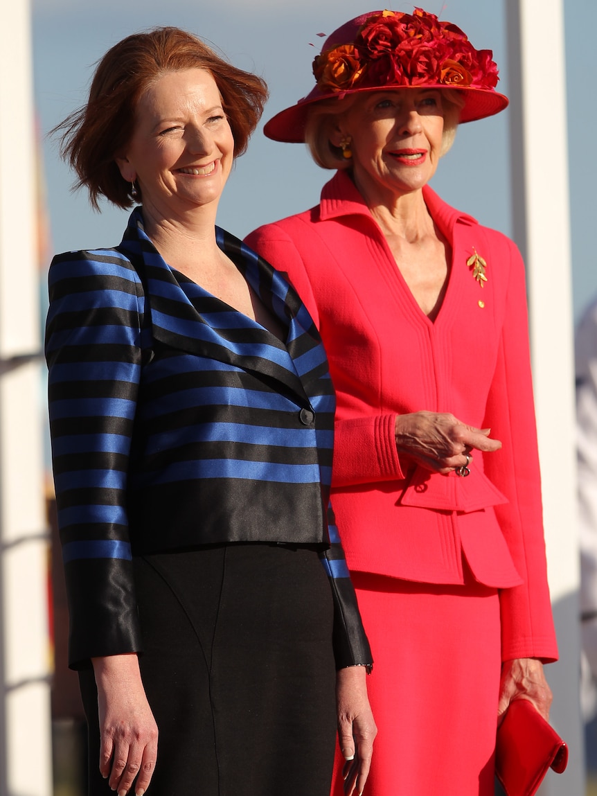 Prime Minister Julia Gillard and Quentin Bryce, Governor General await the arrival of Queen Elizabeth II.