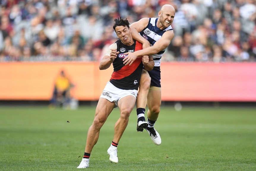 Gary Ablett makes contact with his elbow to the head of Dylan Shiel during the Cats versus Bombers match.