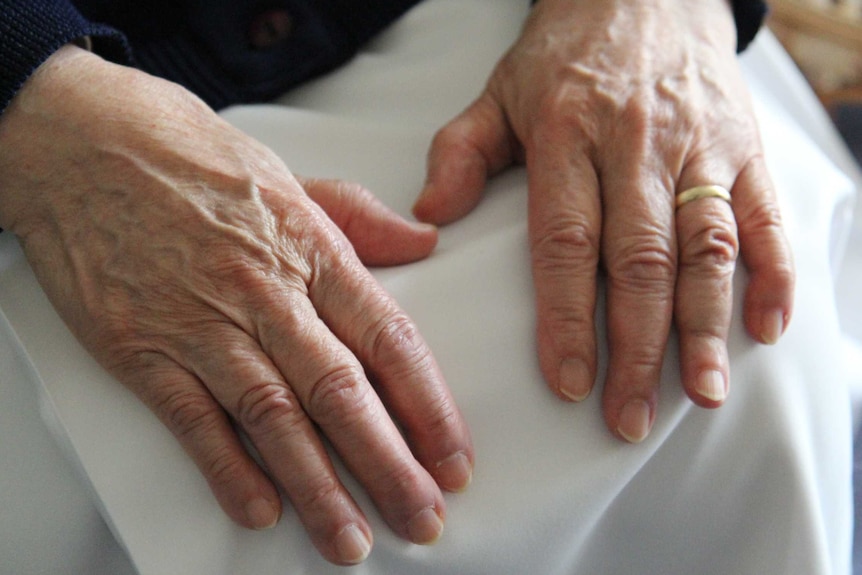 Sister Jacinta Fong holds her hands in her lap at the Sisters of Charity Convent.