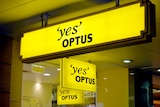 Optus signs outside a shop in Brisbane