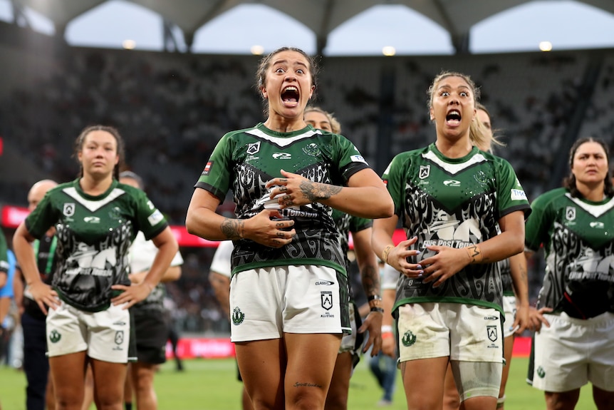 Players from the Māori Ferns All Stars perform the haka