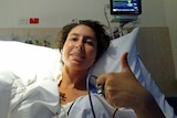 Zerena Di-Prima gives the thumbs up from a hospital bed.