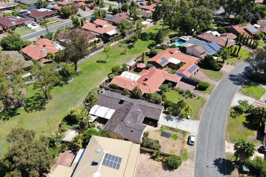 An aerial view of parks, roadways and rooftops