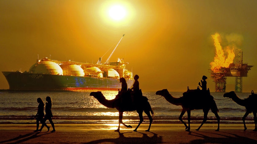 The poster depicting camels on Cable beach with LNG ship and drill rig in background