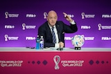 Gianni Infantino holds up a finger