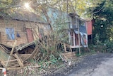 A house has crumbled after being swept of its foundations.