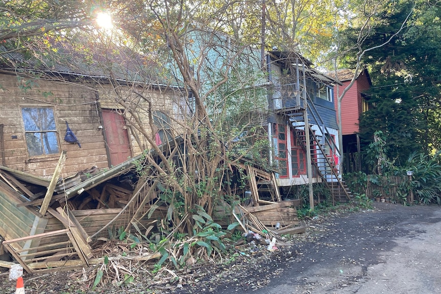 A house has crumbled after being swept of its foundations.