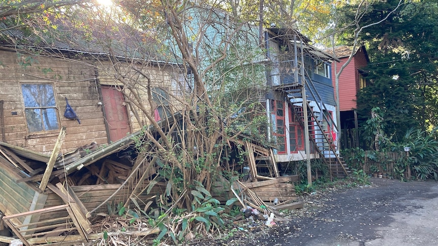 A house has crumbled after being swept of its foundations.