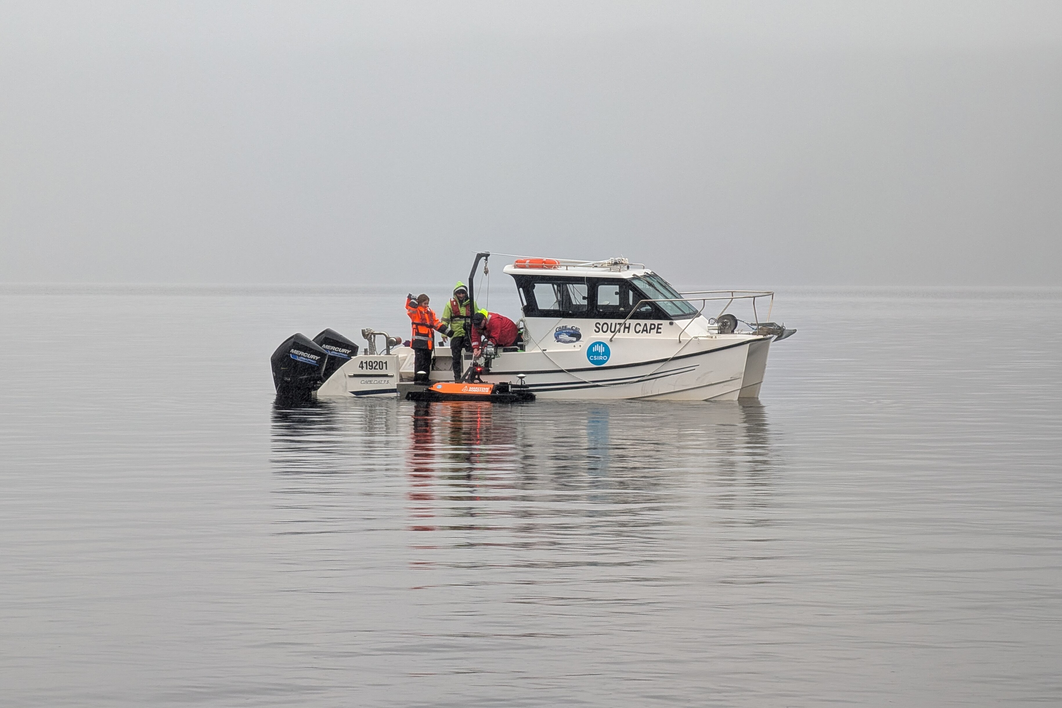 a small boat on a still lake