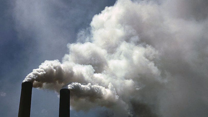 Smoke billowing from smoke stacks