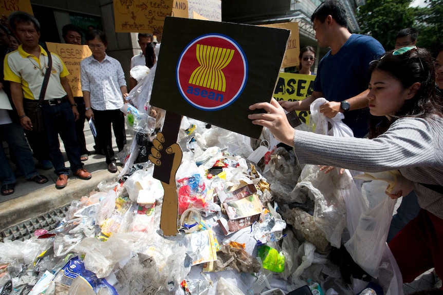Thai activists put logo ASEAN on plastic and electronic waste at Foreign Ministry Bangkok, Thailand.