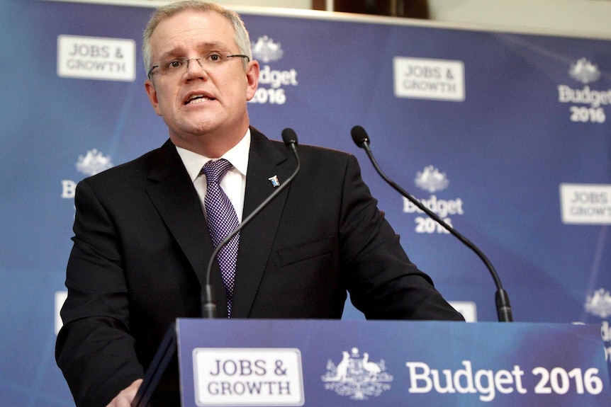 Treasurer Scott Morrison speaks at a podium in the budget lock up.