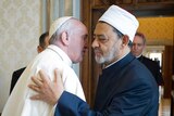 Pope Francis and Ahmed al-Tayeb greet each other.
