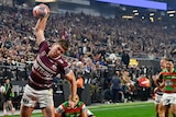 Manly Sea Eagles Reuben Garrick spikes a ball after a try against South SYdney in the NRL Las Vegas season opener.