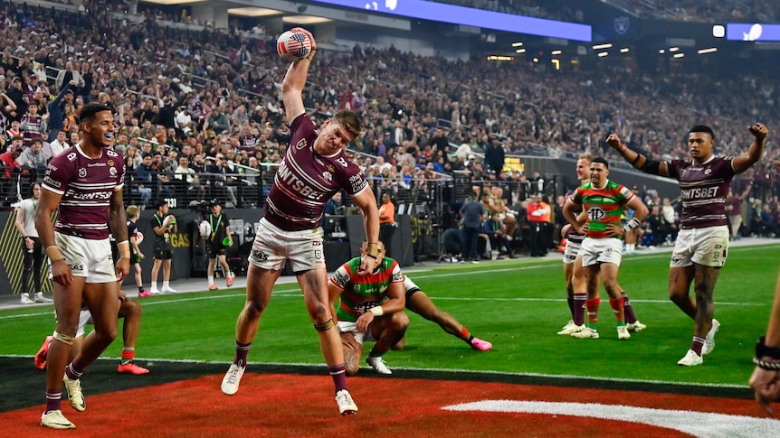 Manly Sea Eagles Reuben Garrick spikes a ball after a try against South SYdney in the NRL Las Vegas season opener.