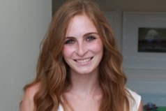 Woman with long hair and a white top