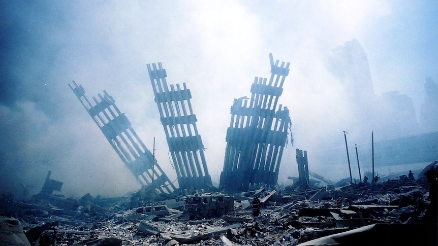 The rubble of the World Trade Centre towers smoulder on September 11, 2001. (AFP: Alexandre Fuchs)