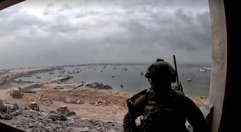 a soldier looks out at the port of gaza allegedly